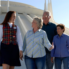 A Cast Member gives Guests a tour of Disneyland.